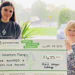 Marj handing over large cheque for £435