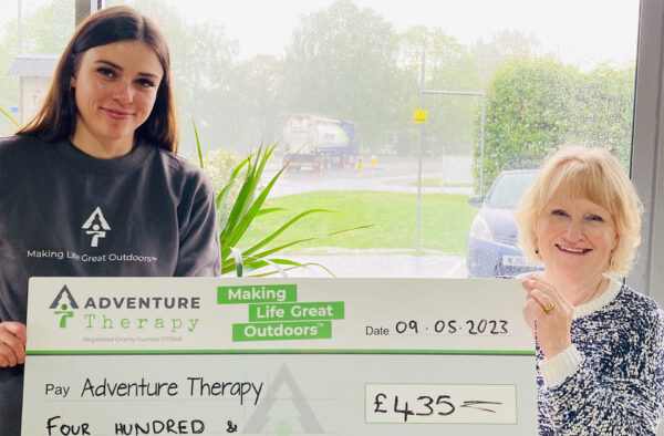 Marj handing over large cheque for £435