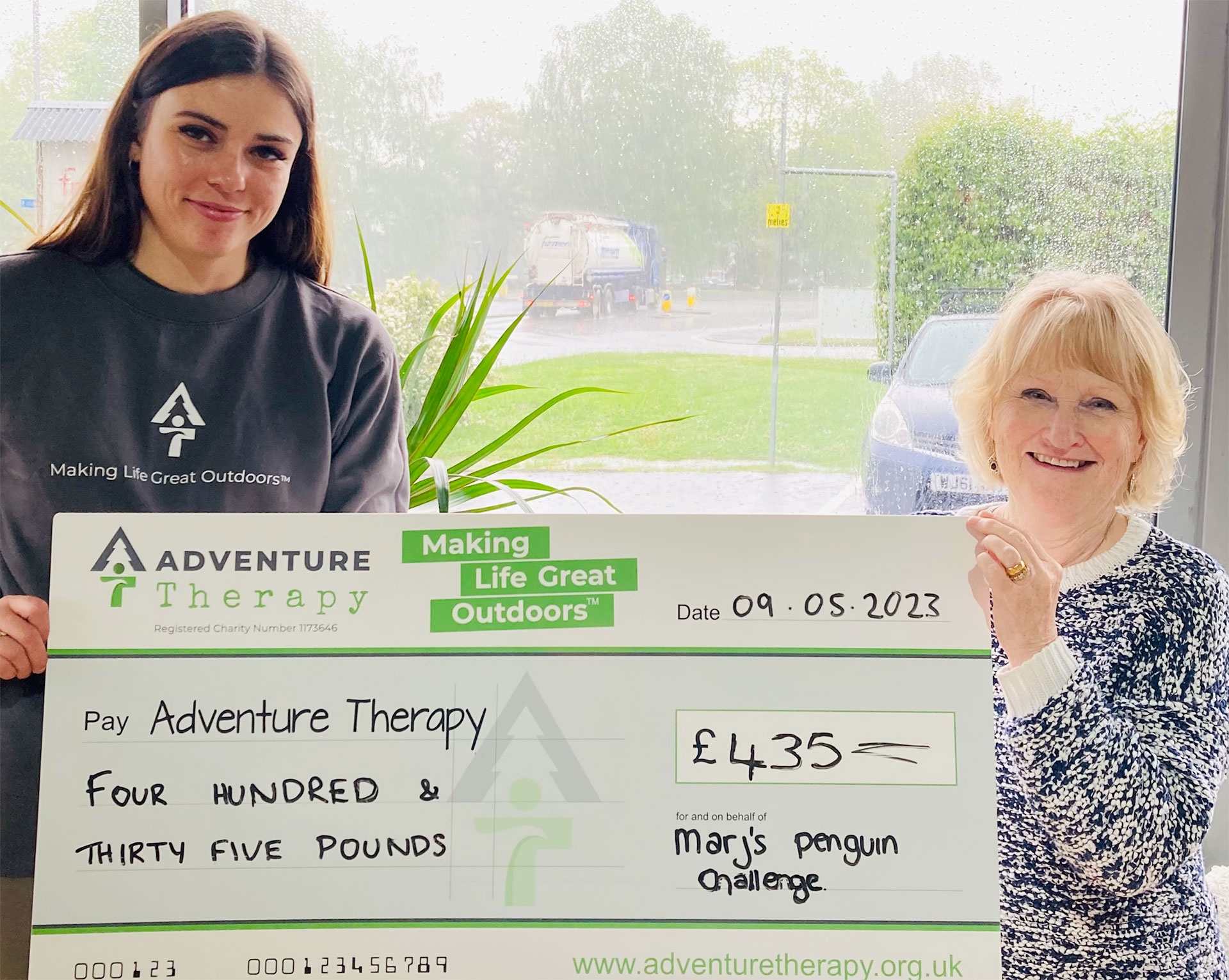 Marj handing over large cheque for £435