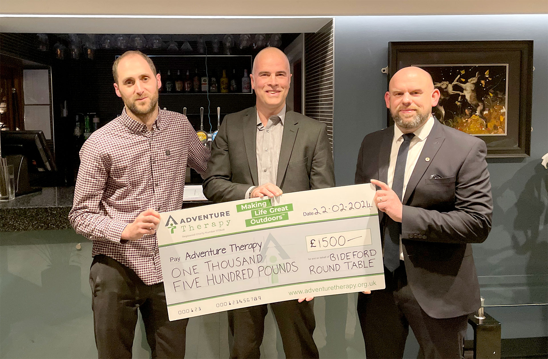 Rob Emery receiving a cheque donation