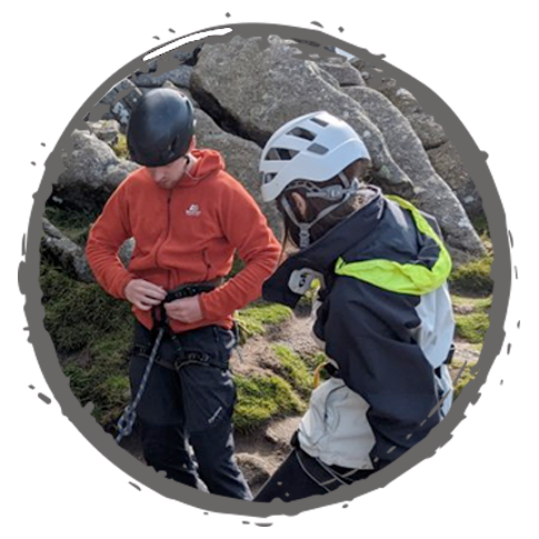 Attaching ropes preparing for a rock climb